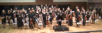 Sarah-Grace Williams, Artistic Director and Chief Conductor of the Metropolitan Orchestra takes a bow Sarah-Grace Williams, Artistic Director and Chief Conductor of the Metropolitan Orchestra takes a bow